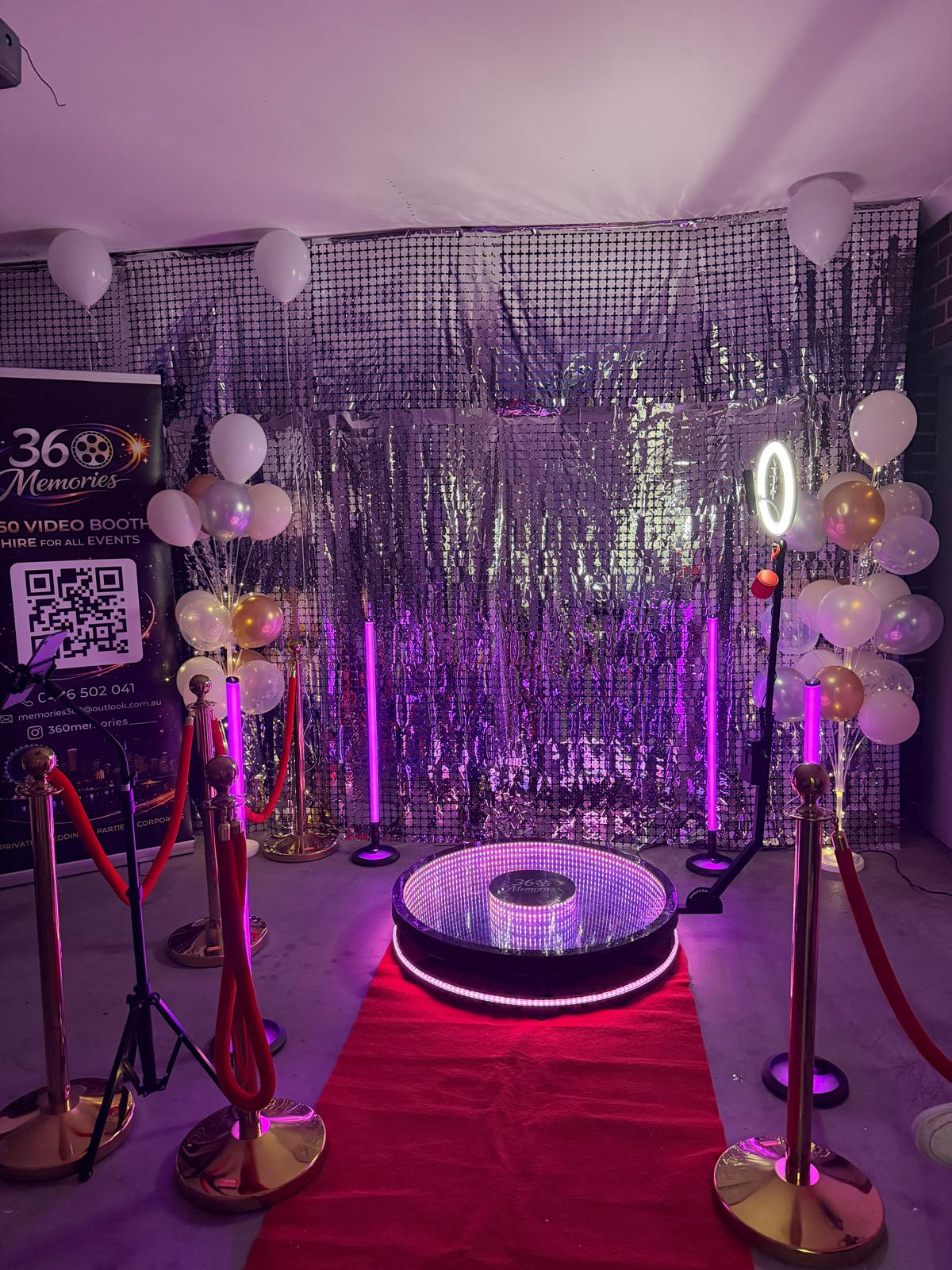 360 booth with silver sequin backdrop and balloons