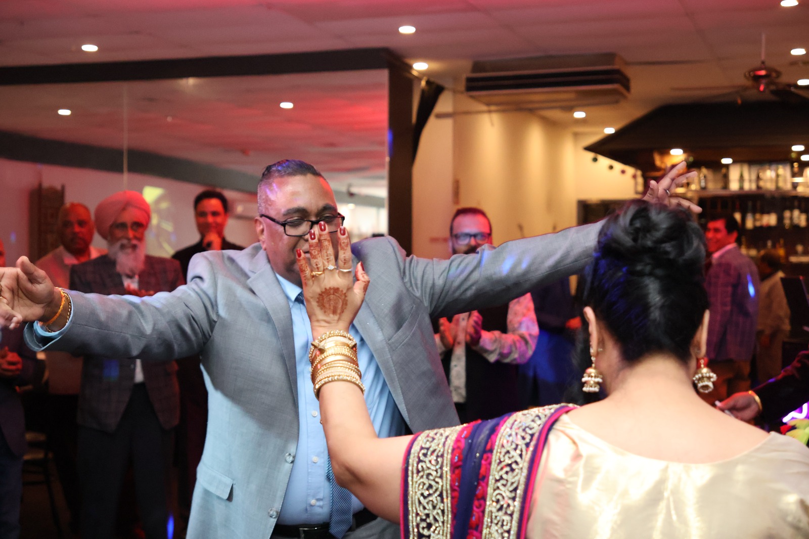 Two guests dancing together on the dance floor
