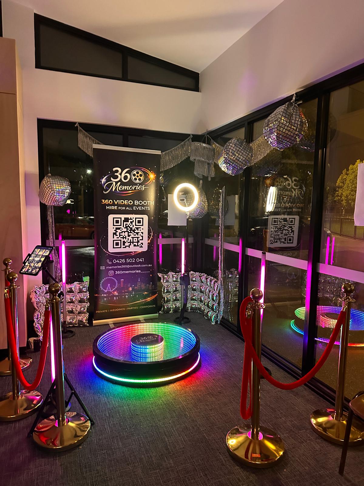 360 video booth with disco balls and neon accents