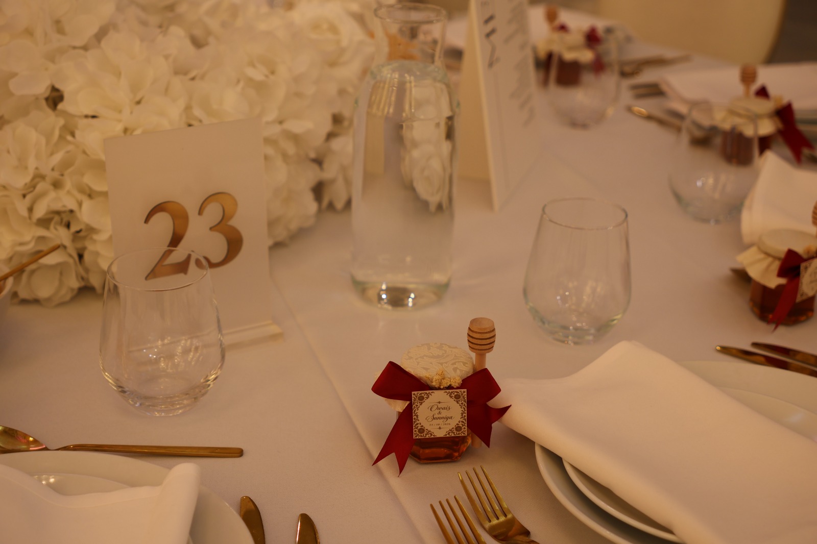 Table 23 setting with glassware and favours